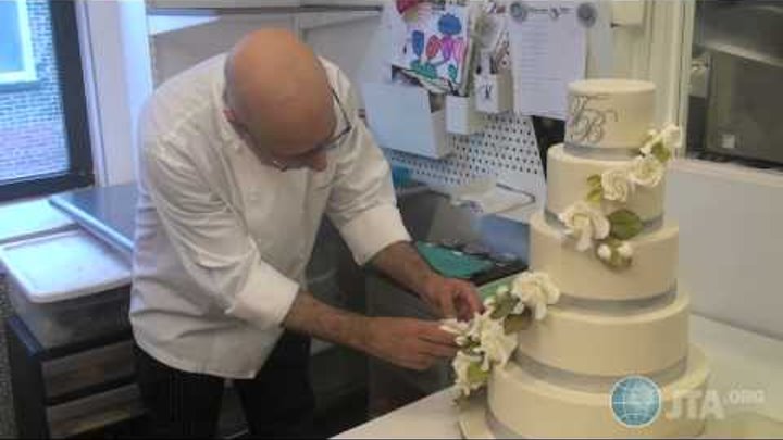 Food Network "Sweet Genius" Ron Ben-Israel decorates a wedding cake
