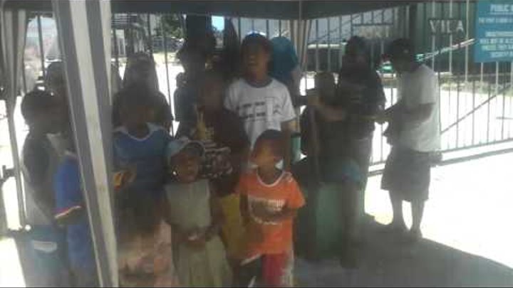 Port Vila, Vanuatu, Children sing near to liner Sea Princess