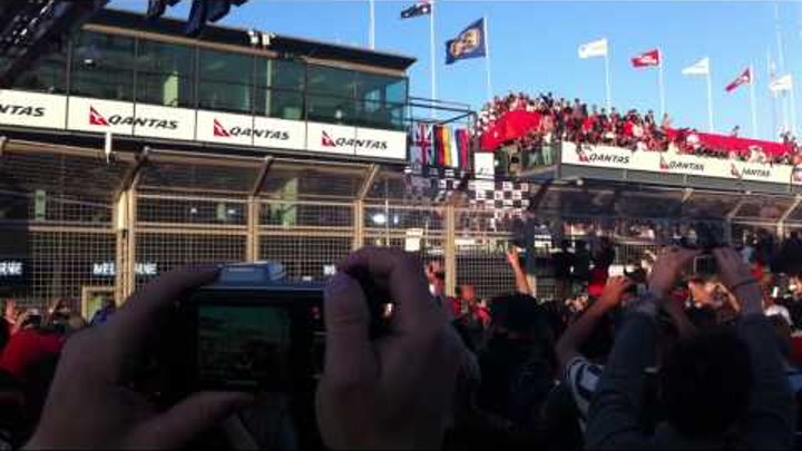 2011 Australian Formula 1 Grand Prix: Podium celebration from the crowd on main straight