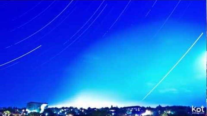 The motion of stars over the night city Zaporozhye, timelapse.
