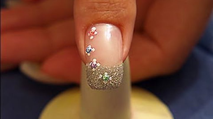 Nail art with half pearls and glitter-powder in silver Nail art with half pearls and glitter-powder in silver