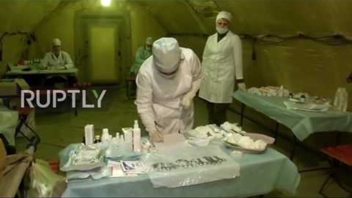 Syria: Russian doctors treat Aleppo residents in makeshift medical tent