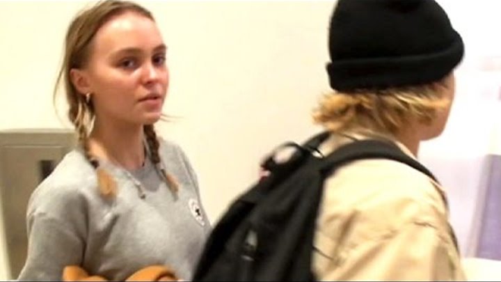 Lily-Rose Depp In Pig Tails Without Makeup For Air Travel.