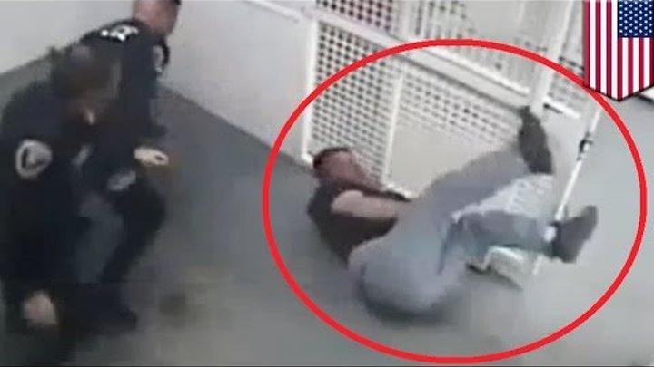 Police Brutality: Cops fired after video shows handcuffed suspect beaten in cell - TomoNews